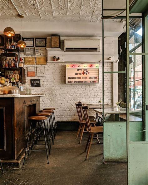 Rustic Industrial Cafe Interiors With Wooden Accessories And Metalwork