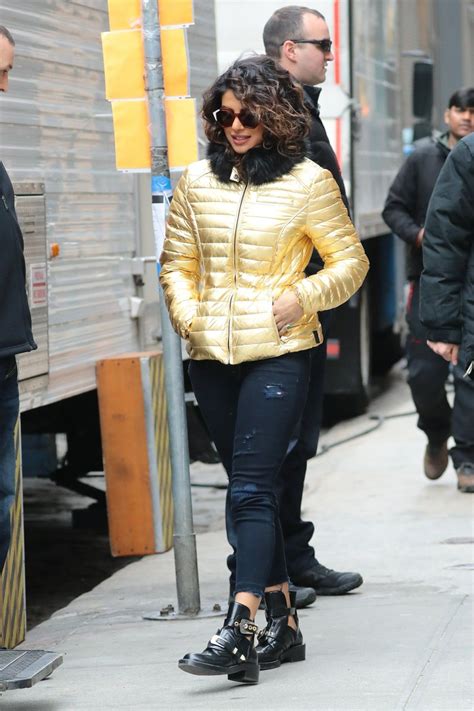 Priyanka Chopra On The Set Of Quantico Wearing A Gold Puffy Coat With