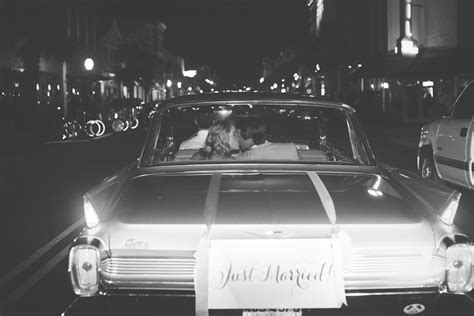 bride and groom getaway in a 1962 cadillac deville charleston