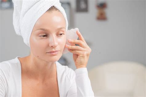 Face Massage Beautiful Woman Is Getting Massage Face Using Jade Stone For Skin Care Stock Image