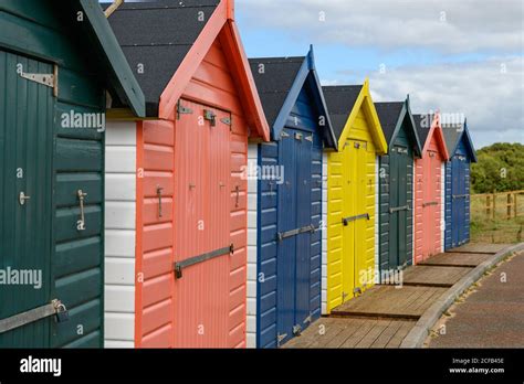 Colorful Beach Huts In Devon Stock Photo Alamy