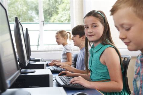 Group Of Elementary School Children In Computer Class Stock Image