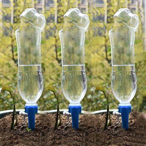 Family plant watering stakes10 pack automatic plant waterers for vacations, plant watering devices terracotta self watering spikes for wine bottles great plant nanny for indoor & outdoor plants. Drip irrigation system Plant Waterers DIY Automatic drip water spikes taper watering plants ...