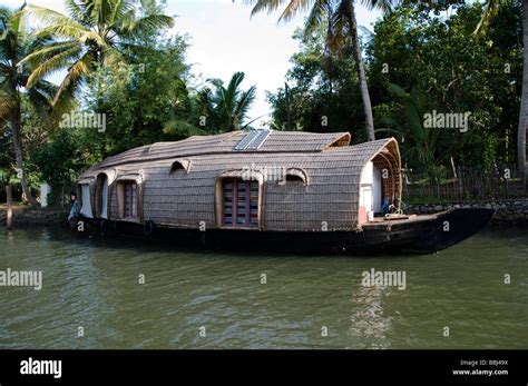 Traditional Rice Boat Or Kettuvallam Houseboat In Backwaters Of Kerala