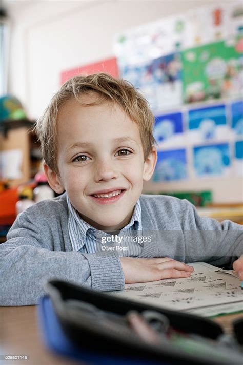Happy School Boy Sitting In Class Room High Res Stock Photo Getty Images