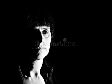 Hard Light Dark And Rather Depressing Sad Portrait Stock Photo