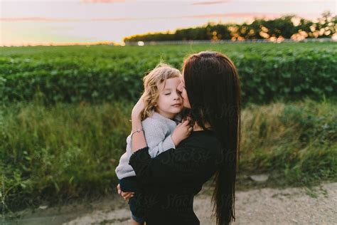 Mother Embracing Her Son By Stocksy Contributor Evgenij Yulkin