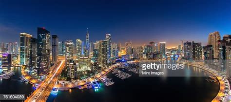 Cityscape Of Dubai United Arab Emirates At Dusk With Illuminated