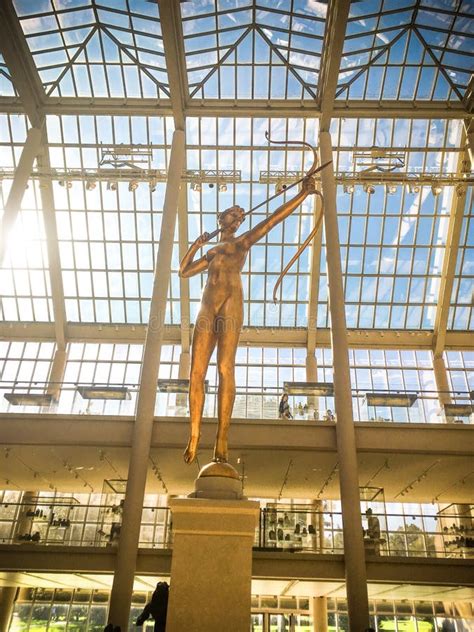 Gold Statue Of Naked Woman Shooting A Bow And Arrow Editorial Stock