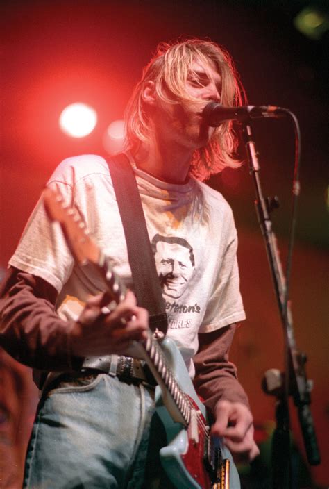 With a gravelly voice, blue eyes peeking out from curtains of blond hair, and an expression. I Was Here.: Kurt Cobain