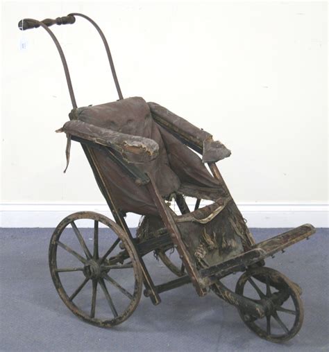 A Victorian Trotmans Patent Perambulator Painted In Black With Line