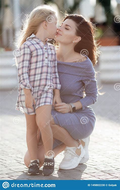 Photo Of Happy Daughter And Mother Walking Outdoors On The