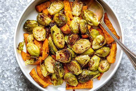 By maria marlowe | updated: Oven-Roasted Brussels Sprouts and Sweet Potatoes Recipe - Baked Brussels Sprouts Sweet Potato ...