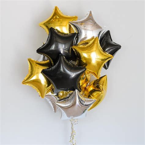 Premium Photo Set Of Deep Black And Gold Helium Balloons Stars