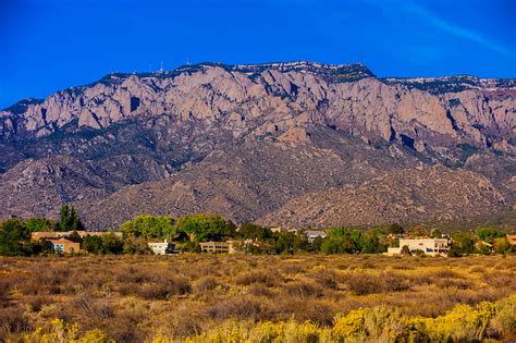 Houses On Simms Park Road With The Sandia Mountains Cibola National