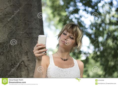 Young Woman Outdoors Taking Photo Or Selfie With Cell Phone S Ca Stock