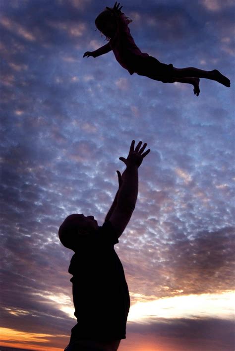 Kid Being Thrown Into The Air By Father Children Photography By