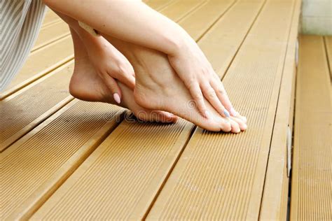 Bare Feet A Woman Is Standing Barefoot On The Wooden Floor Stock Photo Image Of Sitting