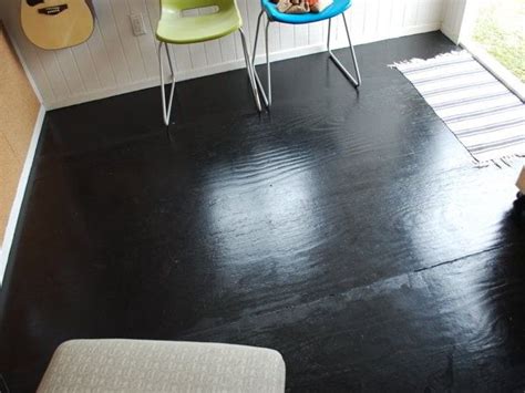 A gallon costs around $25 and lasts for approximately 500 square feet. Black glossy painted plywood floors. | Painted plywood floors, Plywood flooring, Flooring