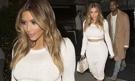 kim kardashian shows off her golden globes in revealing lurex crop top and matching skirt for