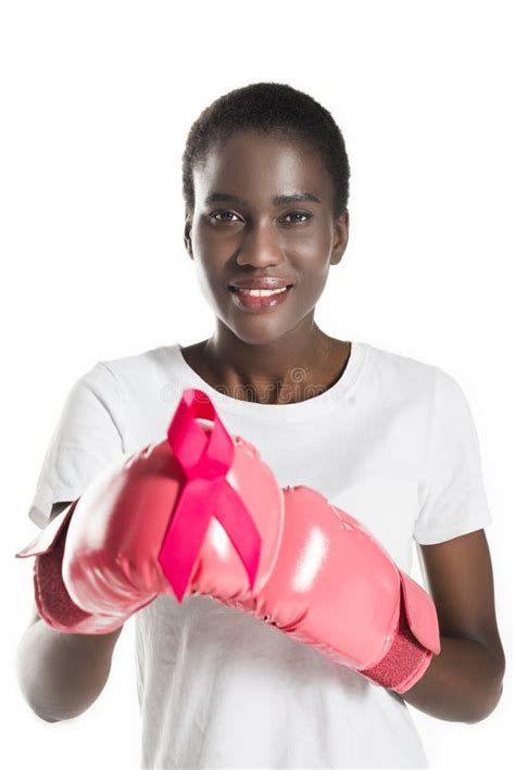 Young African American Woman In Boxing Gloves Holding Pink Ribbon And