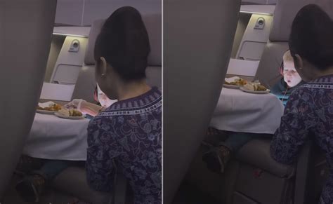 viral video shows flight attendant spoon feeding 5 year old passenger internet divided