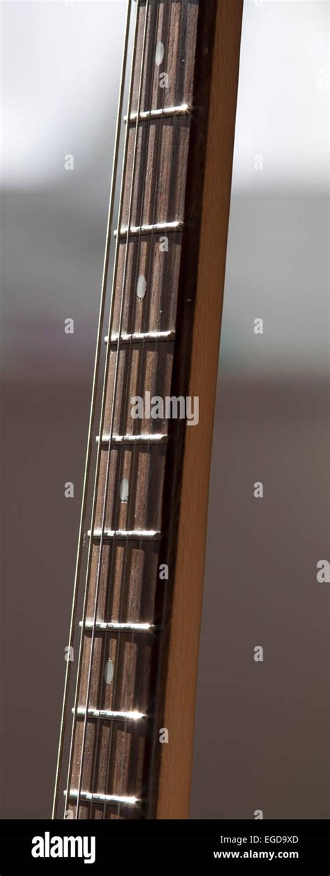 The Fretboard Of An Electric Guitar Showing The Strings And Frets Stock
