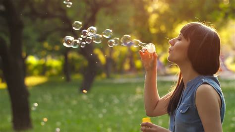 Woman blowing bubbles Stock Video Footage - Storyblocks