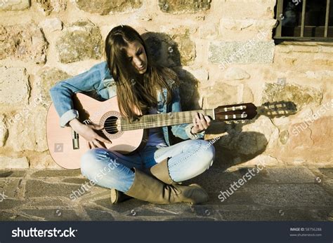 Young Beautiful Woman With His Classical Guitar Stock