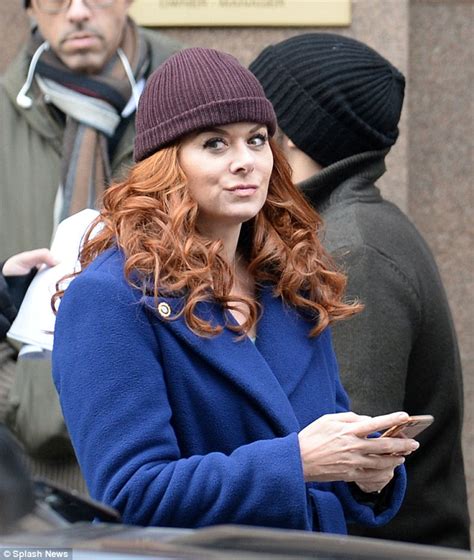 Debra Messing Bundles Up In A Coat On The Mysteries Of Laura Set