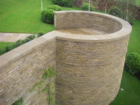 Stone Copings Shaped To Top A Curved Dry Stone Wall Dry Stone Wall Coping Stone Stone Cladding