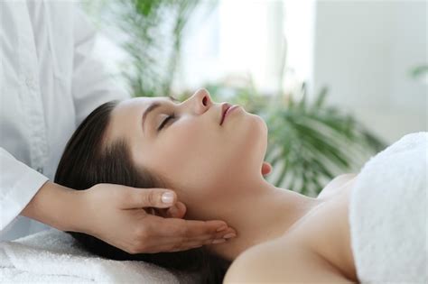 Free Photo Lying Woman Receiving A Massage Craniosacral Therapy