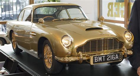 Gold Plated Aston Martin Db5 Model At Christies Charity Auction