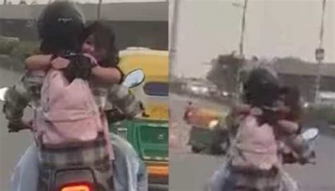 Video Of Delhi Couple Hugging While Riding Bike Goes Viral Police Says Dont Copy Movies