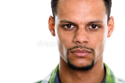 Close Up Portrait Of Young African Man Looking At Camera Stock Photo