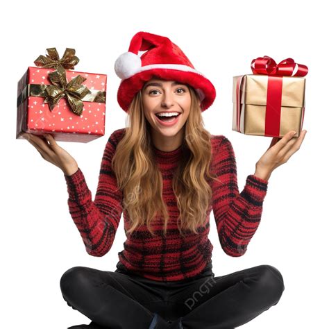 فتاة ترتدي قبعات عيد الميلاد تجلس وفي يديها صناديق هدايا وتشعر بفرحة المفاجأة عائلة عيد الميلاد