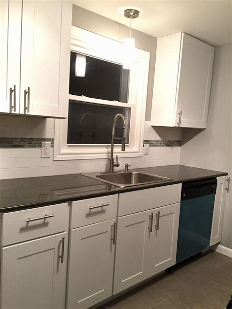 Home depot hampton bay cabinets should not be sold. home depot has dropped the ball on their hampton bay cabinets and totally given up on quality control. Hampton Bay White Shaker Kitchen Cabinets With Subway Tile ...