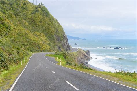 Free Photo New Zealand Coastal Highway A Scenic Road Winds Along The