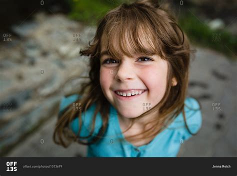 Portrait Of A Young Girl With Brown Hair Smiling Stock Photo Offset