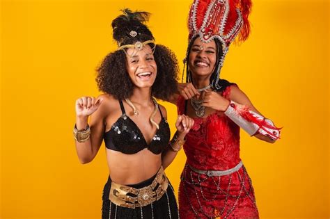 Premium Photo Two Brazilian Women Friends In Carnival Clothes Dancing