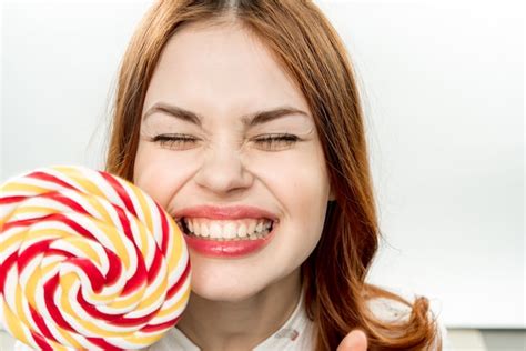 Premium Photo Woman Posing With A Lollipop