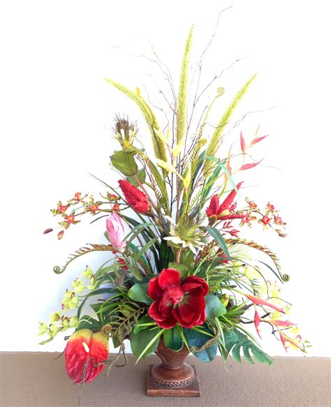 Designed By Arcadia Floral And Home Decor Tropical Floral Arrangements Christmas Floral