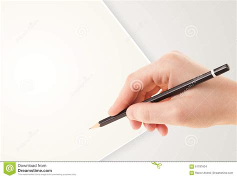 Human Hand Drawing With Pencil On Empty Paper Template