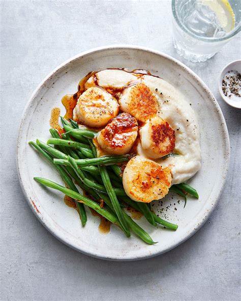 Pan sear your scallops in a small amount of oil or spray until cooked through. Seared scallops on pea and mint risotto recipe | delicious. magazine