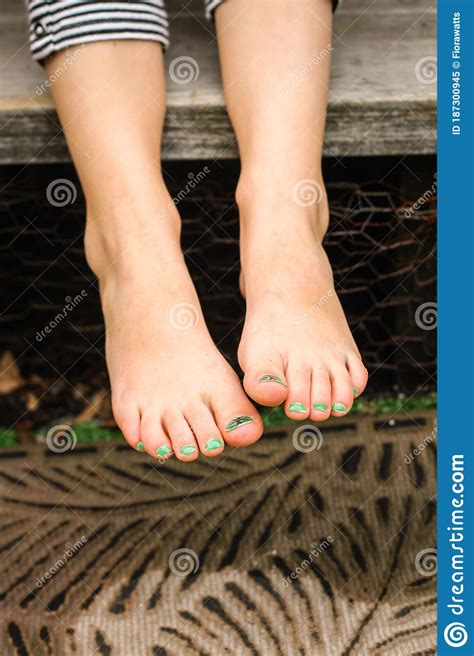 Closeup Of A Girl S Bare Feet With Green Painted Toenails Stock Image