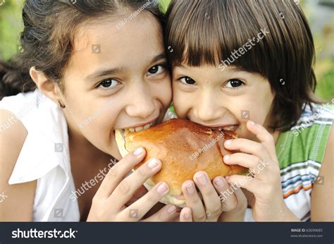 Closeup Two Children Eating Sandwich Nature Stock Photo 63699685