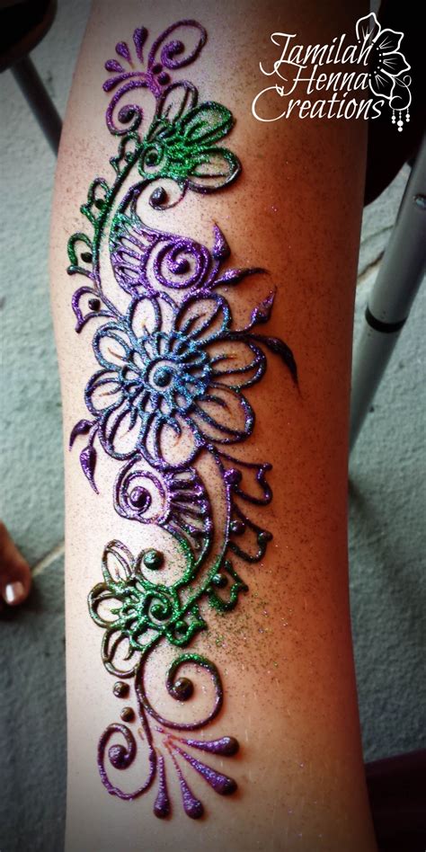 You can also make your henna tattoo last longer by ensuring your skin is thoroughly exfoliated and shave before applying it. Henna with multi colored glitter www.JamilahHennaCreations ...