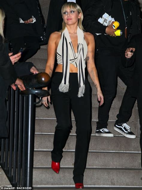 Miley Cyrus Suffers Wardrobe Malfunction In Busty Wrap Crop Top As She