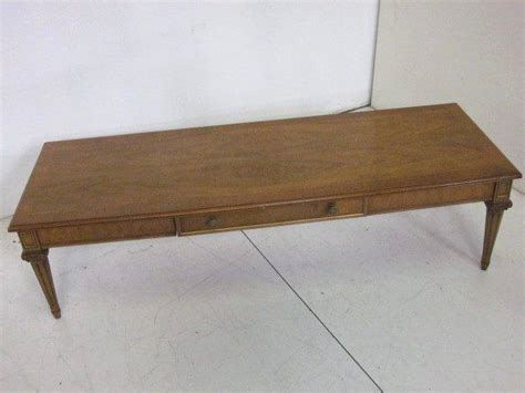 This henredon coffee table is a great example of japanese crafting. 1950's walnut Henredon banded coffee table