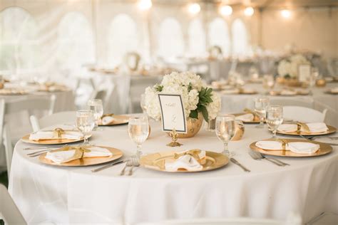Ivory And Gold Accents Provide An Elegant Table Setting At This Outdoor
